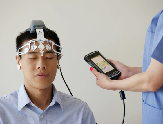 Neurology specialist consulting with a patient about brain health, migraines, memory concerns, nerve disorders, and neurological treatment.