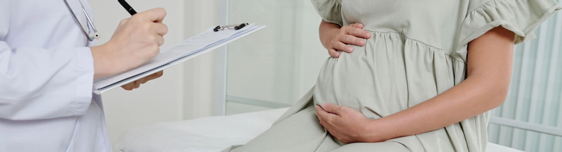 OB-GYN specialist providing women's healthcare consultation for pregnancy, fertility, reproductive health, and gynecological care