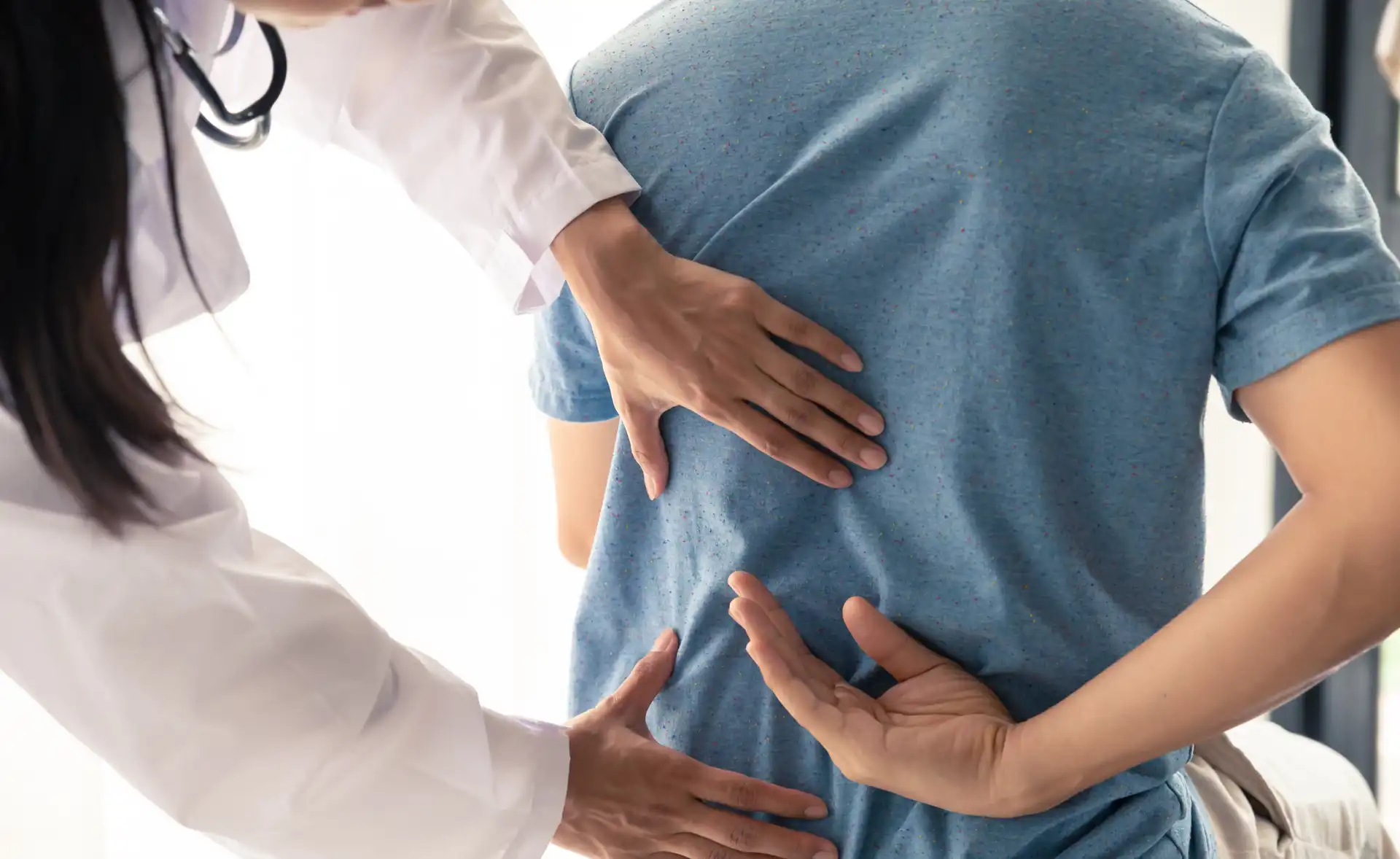 Board-certified orthopedic specialist consulting with a patient for bone, joint, muscle, spine, and mobility care.